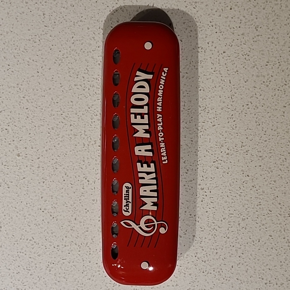 EUC Schylling learn to play harmonica